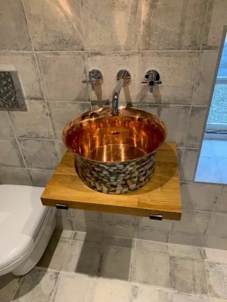 Copper sink with wall mounted taps: Swipe To View More Images
